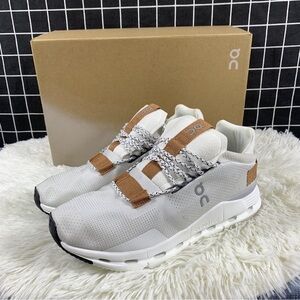 On Running Cream and Brown Athletic Shoes